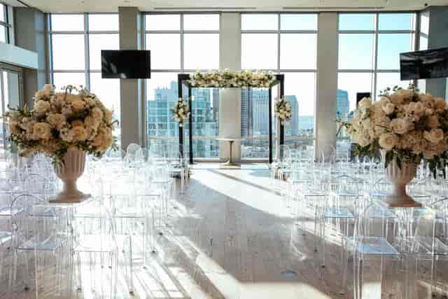 Main Room at Ultimate Skybox with clear acrylic chairs, ideal for weddings and events.