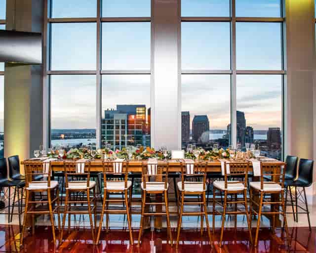 Bar area in The Ultimate Skybox with skyline view, ideal for upscale events and gatherings.
