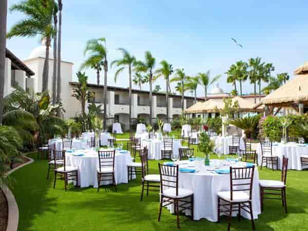 Outdoor event space at Kona Kai Resort with round tables, ideal for weddings and retreats.