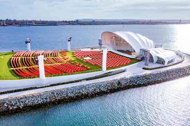 Covered Stage in The Shell amphitheater, ideal for concerts and events by the waterfront.