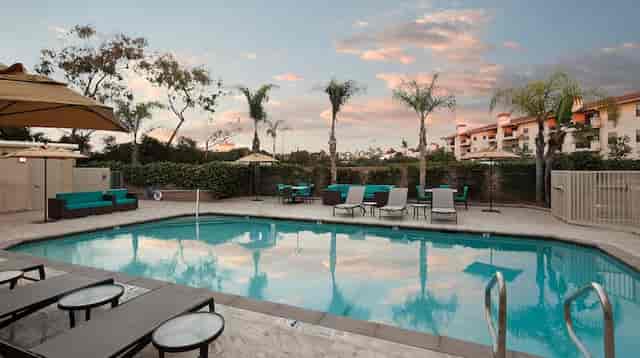 Serene pool area at Tapestry Collection by Hilton, ideal for outdoor events and networking.