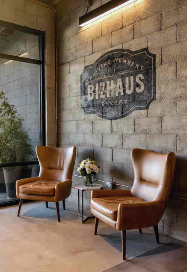 Stylish BizHaus meeting space with leather chairs, ideal for networking events.
