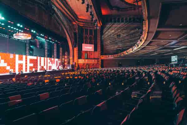 Shrine Expo Hall stage with vibrant lighting for large events and gatherings.