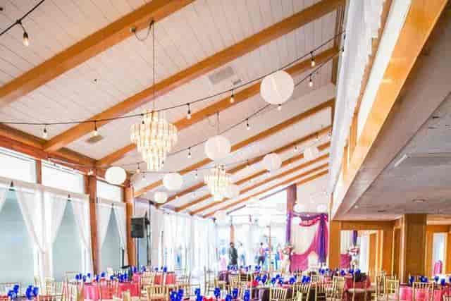 Elegant chapel event space with chandeliers, ideal for weddings and corporate gatherings.