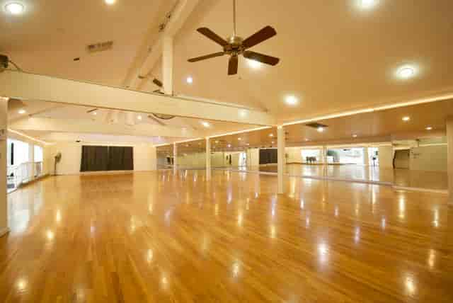 Spacious event venue with polished floors and mirrors at South Bay Dance Center.