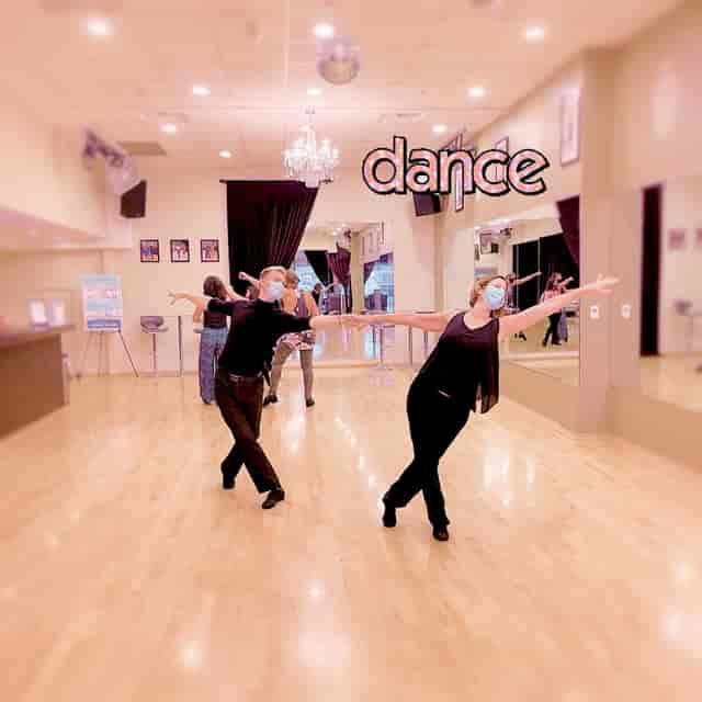 Vibrant dance studio with wooden floor, ideal for workshops and social events.