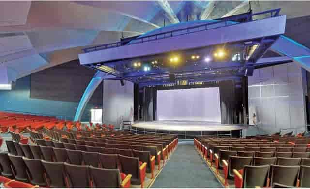 Modern auditorium with tiered seating, ideal for conferences and performances.