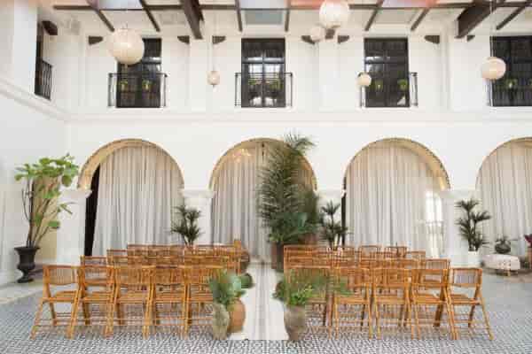 Elegant banquet hall with wooden chairs, ideal for intimate gatherings and ceremonies.