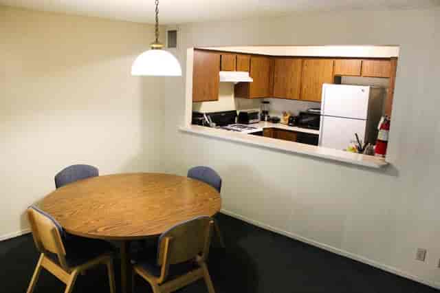 Meeting room with round table and chairs at Cal State LA for group discussions.