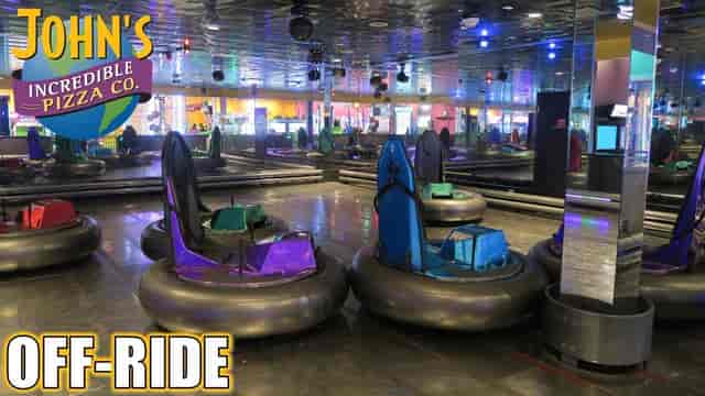 Bumper cars at John's Pizza arcade, perfect for team-building and family fun.