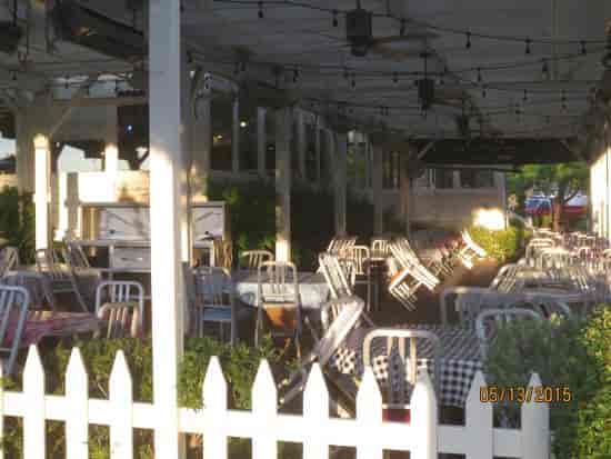 Outdoor event space at Lucille's BBQ with rustic charm and warm string lights.