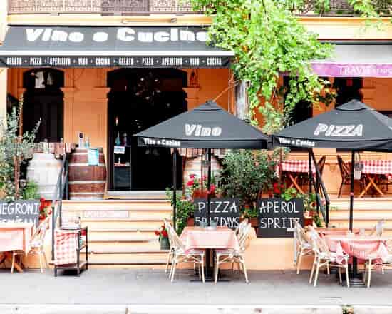 Charming outdoor dining space with vibrant umbrellas for casual events and gatherings.