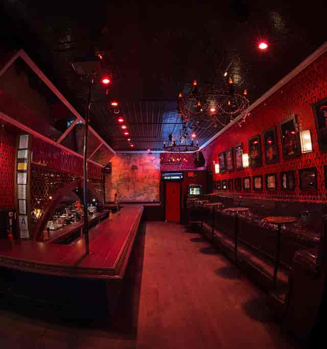 "Eastside Luv Wine Bar with elegant chandelier, perfect for cocktail receptions and events."