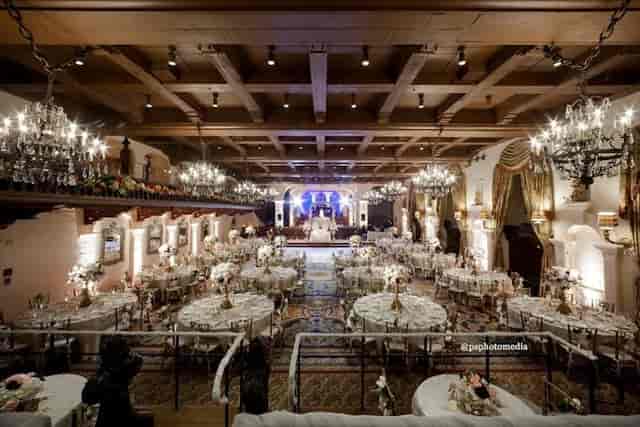 Grand Parisian Ballroom with floral centerpieces, perfect for weddings and galas.