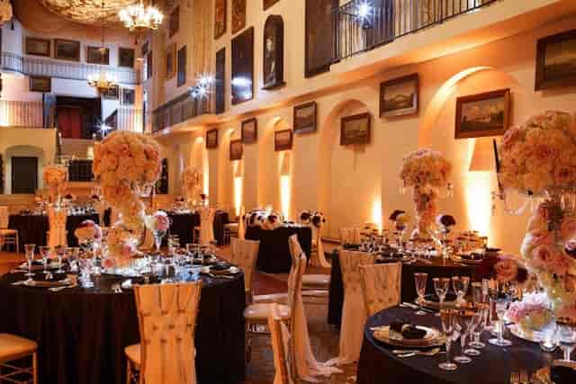 Grand Parisian Ballroom with floral centerpieces, perfect for weddings and gala dinners.