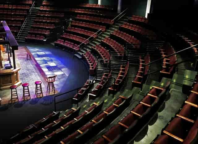 Ballroom at Lamb's Players Theatre with tiered seating for intimate performances and events.