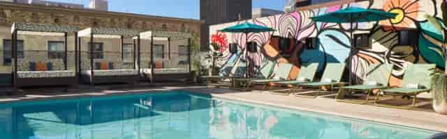 Enrique at Kimpton Alma Hotel rooftop pool, ideal for networking events and social gatherings.