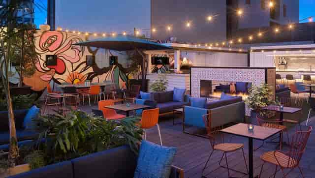 Vibrant outdoor event space at Kimpton Alma Hotel for networking receptions and gatherings.