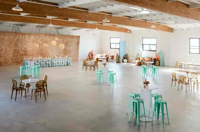 Spacious indoor event venue in Salt Drift Pointe with pastel seating and stylish decor.