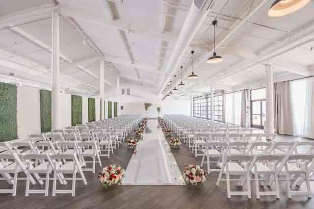 Indoor wedding venue in Salt Drift Pointe with elegant floral arrangements and natural light.