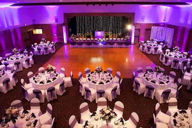 Elegant wedding venue with floral centerpieces and purple accents in San Diego County.