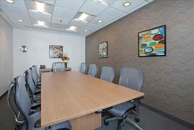 Modern conference room with ergonomic chairs for productive coworking meetings.