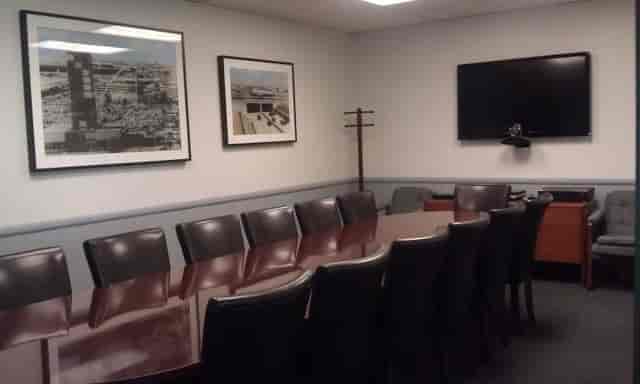 Day Office conference room with long table, ideal for meetings and presentations.