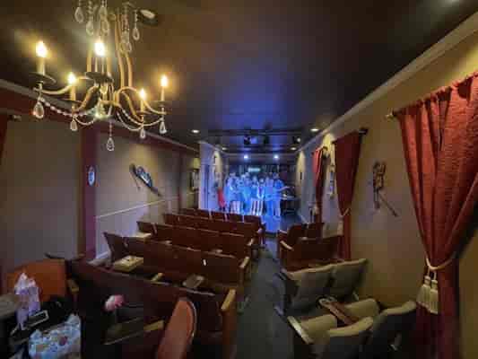 Cozy Aurora Theater with elegant decor for intimate events and workshops.