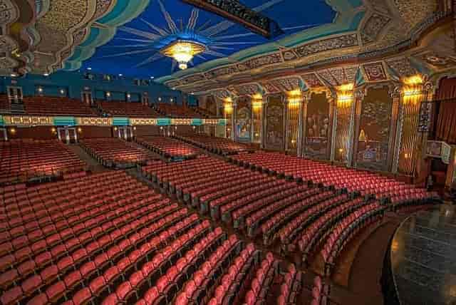 Elegant Aurora Theater with ornate ceiling, ideal for conferences and performances.
