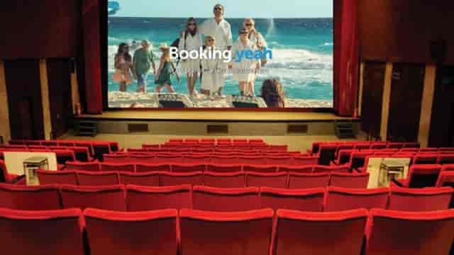 Spacious Aurora Theater screening room with red seats for travel presentations.