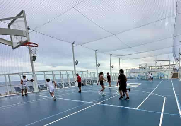 Outdoor basketball court on cruise ship, perfect for team-building and recreational events.