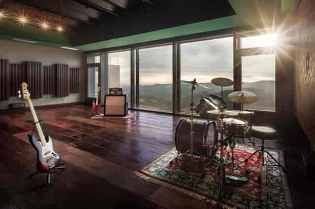 Rehearsal space with large windows for music events and creative workshops.