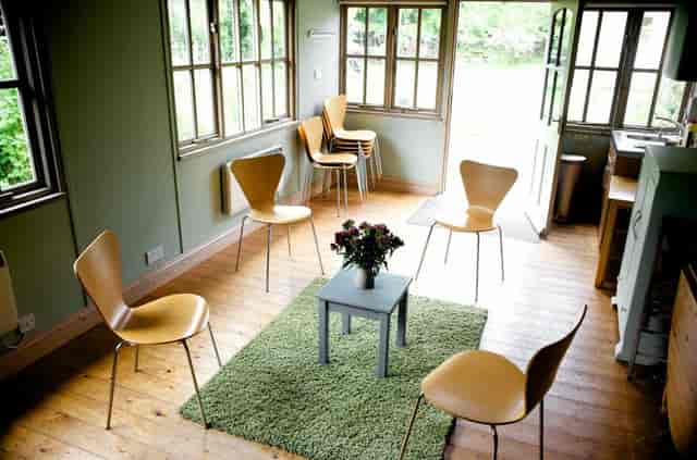 Cozy Garden Room at Brentford Quaker Meeting House for team-building and discussions.