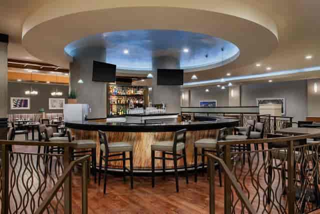Modern bar area in DoubleTree by Hilton Norwalk, ideal for networking events and gatherings.