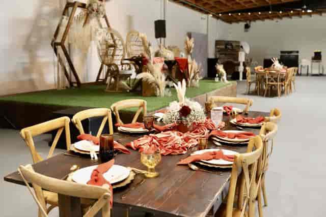 Rustic dessert table with dried flowers for elegant event gatherings and celebrations.