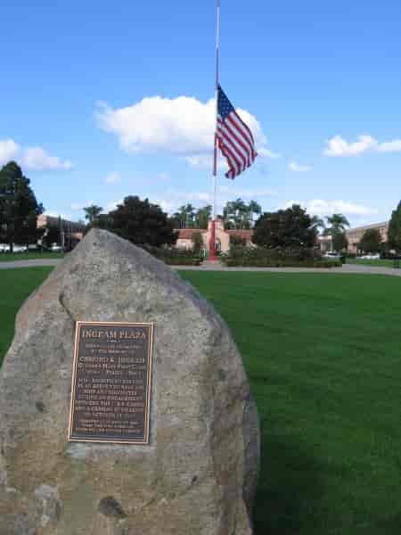 Ingram Plaza outdoor event space with flag and greenery, ideal for ceremonies and gatherings.