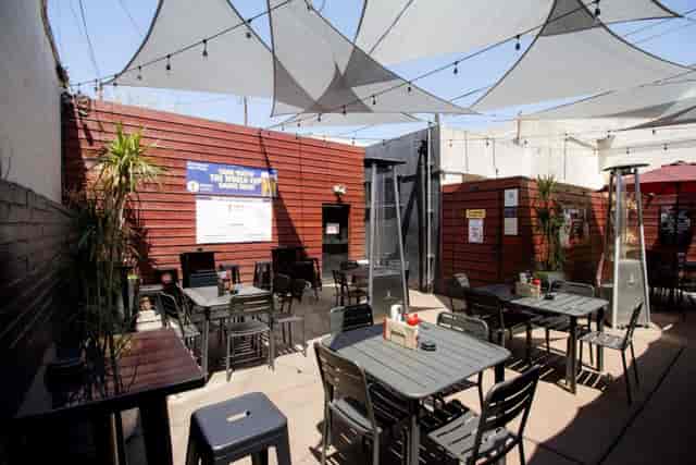 Indoor event space at Redwing Bar and Grill, modern seating for casual gatherings.