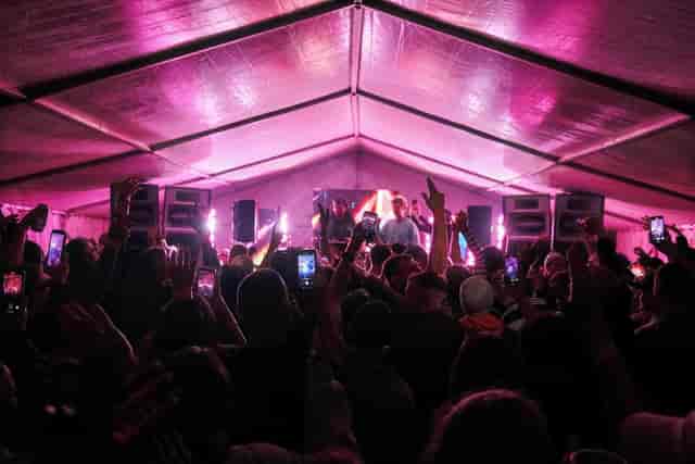 Vibrant live performance at Discotech with dynamic lighting and engaged crowd.