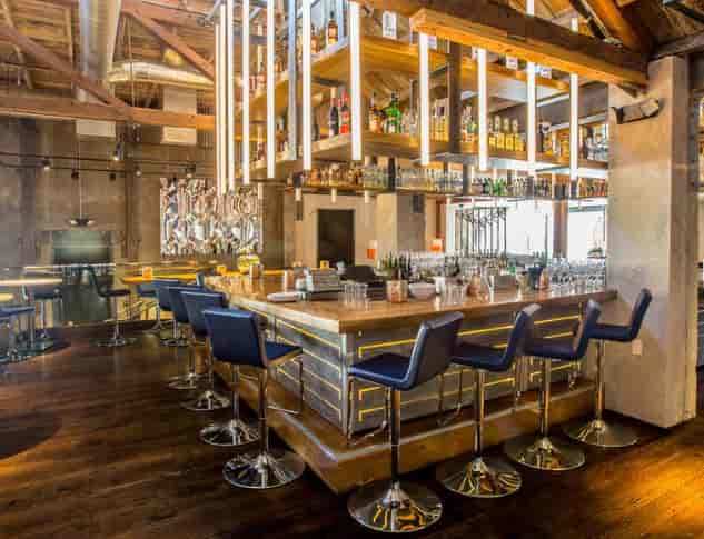 Modern bar at Juniper & Ivy, ideal for networking events and casual meetings.