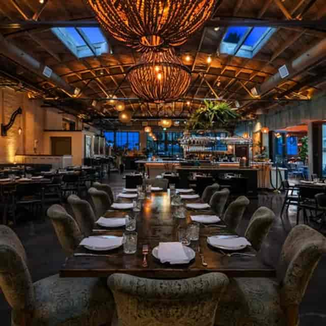Elegant restaurant space with rustic decor, ideal for events and gatherings.