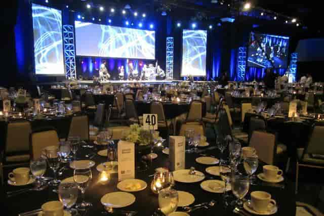 Town and Country Ballroom set for a formal event with elegant dining and modern AV technology.