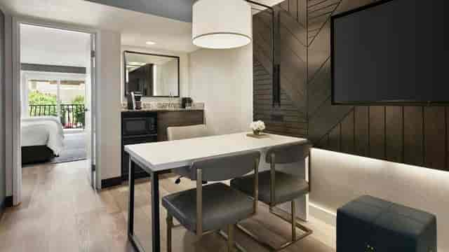 Modern conference room with sleek furniture for productive meetings and events.