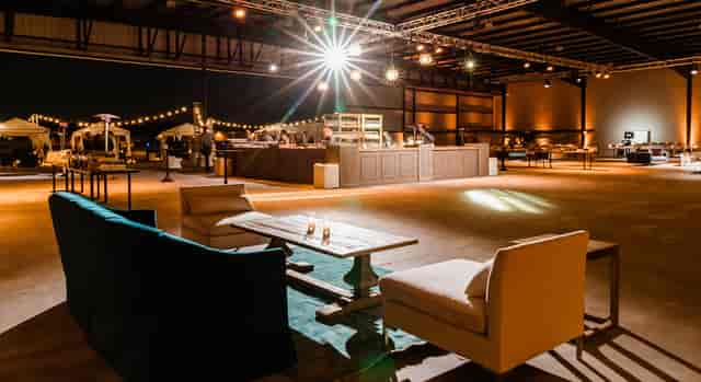 Spacious Hangar 21 South venue with lounge seating for stylish gatherings and events.