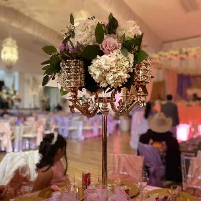 Elegant Small Ballroom with floral centerpiece, perfect for weddings and formal events.