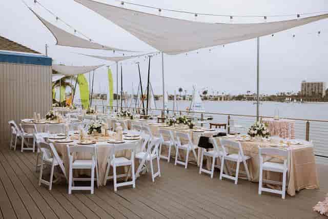 Tower Beach Club outdoor wedding venue with elegant tables and scenic waterfront backdrop.