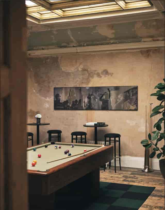 Billiards room with pool table at Knotel Workclub, perfect for networking events.