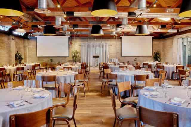 Showcase Room at Culinary Dropout with elegant dining setup for corporate events.