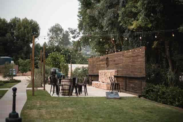Charming outdoor event space with rustic decor, ideal for gatherings and receptions.
