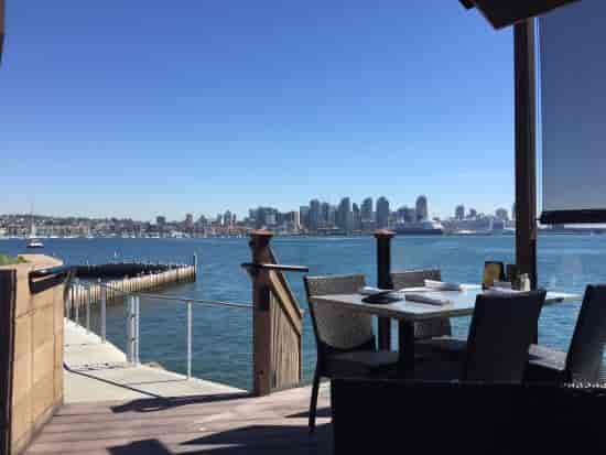 Lanai at C Level Lounge with waterfront view, ideal for outdoor meetings and events.