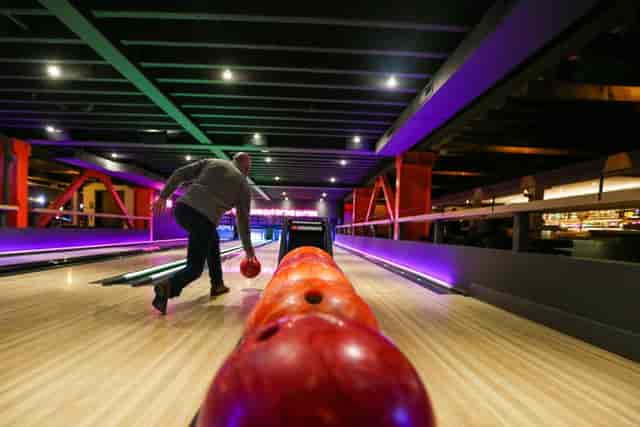Vibrant bowling alley at San Pedro Social for team-building and corporate events.